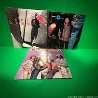 All three album covers front view