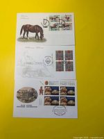 Fronts of all three first day covers stacked vertically