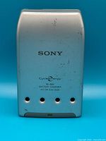 Front view of Sony CycleEnergy charger showing logo, LED window and exterior wear