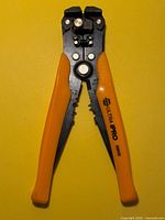 Full view of wire stripper showing handles and printed model number