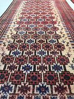 Low-angle close-up of central field highlighting fine weave and geometric motifs