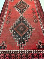 Central section showing stacked diamond medallions and red field