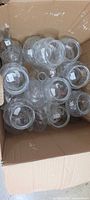 Box of assorted clear glass vases