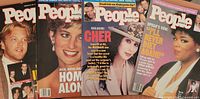 Group shot of four People Weekly magazines: Brad Pitt, Princess Diana, Cher, Oprah covers