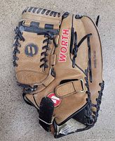 Overall view of Worth TM140 glove showing brand logo and lacing
