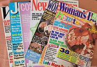 Fanned stack of all six magazines showing titles and cover designs