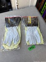 Two sealed packages of Endura goatskin gloves