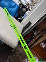 Full view of 48-inch neon green level leaning against table