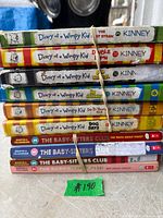 Stack of twelve kids books showing titles and authors