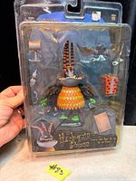 Front of sealed NECA Series 2 Harlequin Demon action figure package with accessories visible