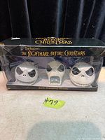 Front view of sealed box showing three Jack Skellington heads and product branding