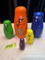 Full set of five Nightmare Before Christmas wooden nesting dolls arranged by size