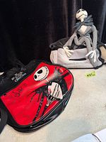 Red tote and plush with additional bag overview