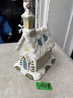 Front three-quarter view of porcelain snow church