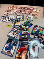 spread of football and hockey cards showing variety