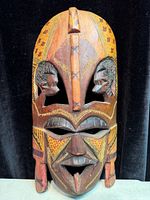 Front view of entire carved wood mask
