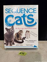 Front of Sequence Cats game box showing title, cat images, age and player information