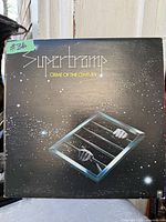 Front cover of Supertramp Crime of the Century LP showing artwork and catalogue branding