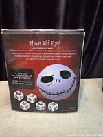 Back of box showing Jack Skellington graphic, feature text and dice images