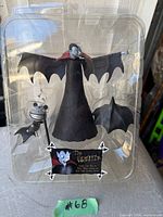 Front view of sealed clamshell package containing The Vampire action figure and accessories