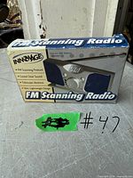 Front of Innovage FM Scanning Radio retail box showing product image and features