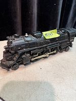 Left front three-quarter view of Lionel 2026 locomotive showing boiler, cab, drive rods