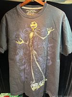 Front view of charcoal Jack Skellington graphic T-shirt hanging