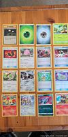 First image shows 16 cards including trainer, energies, holo and common Pokémon