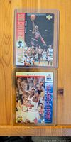 Fronts of both Michael Jordan cards in toploaders