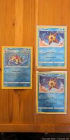 Group shot of Starmie and two Staryu cards in sleeves/top loaders