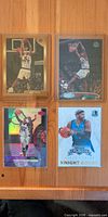 Front view of all four Vince Carter cards