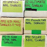 Stacked six labelled card boxes indicating brands and year