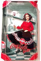 Front view of boxed Coca-Cola Barbie doll