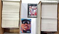Two long rows of stacked baseball cards with two sample cards in front