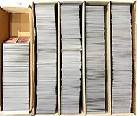 Five-row card storage box filled with loose MTG cards