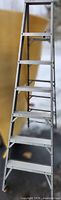 Front view showing seven-step aluminum ladder