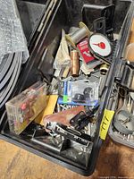 Bin with solder spool, copper fitting, screws, fasteners