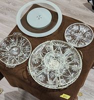 Overview of pressed glass trays, plate, turntable disc