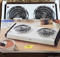 Hot plate in original box showing both coil burners