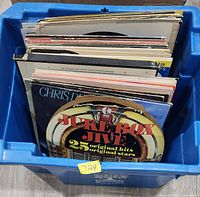 Top view of vinyl records inside blue bin showing front sleeve of Juke Box Jive