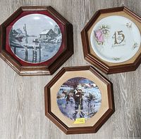 Overview showing all three framed decorative plates