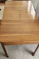 Top view of wooden drop-leaf dining table closed