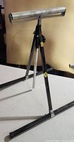 One adjustable roller stand showing tripod base, telescopic column and roller