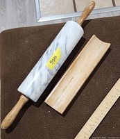 Full view of marble rolling pin on holder