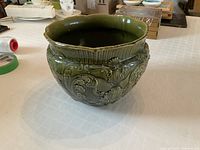 Full view of jardiniere front showing relief design and glaze