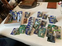 Overview of all sealed Yardworks and Gardsmith hose fittings spread on table