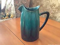 Front view of Blue Mountain Pottery jug showing pinched spout and handle