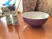 Full view of bowl and two Toby cups on table