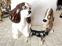 All three ceramic dog figurines grouped