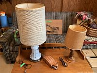 Both lamps and alligator trinket box on table